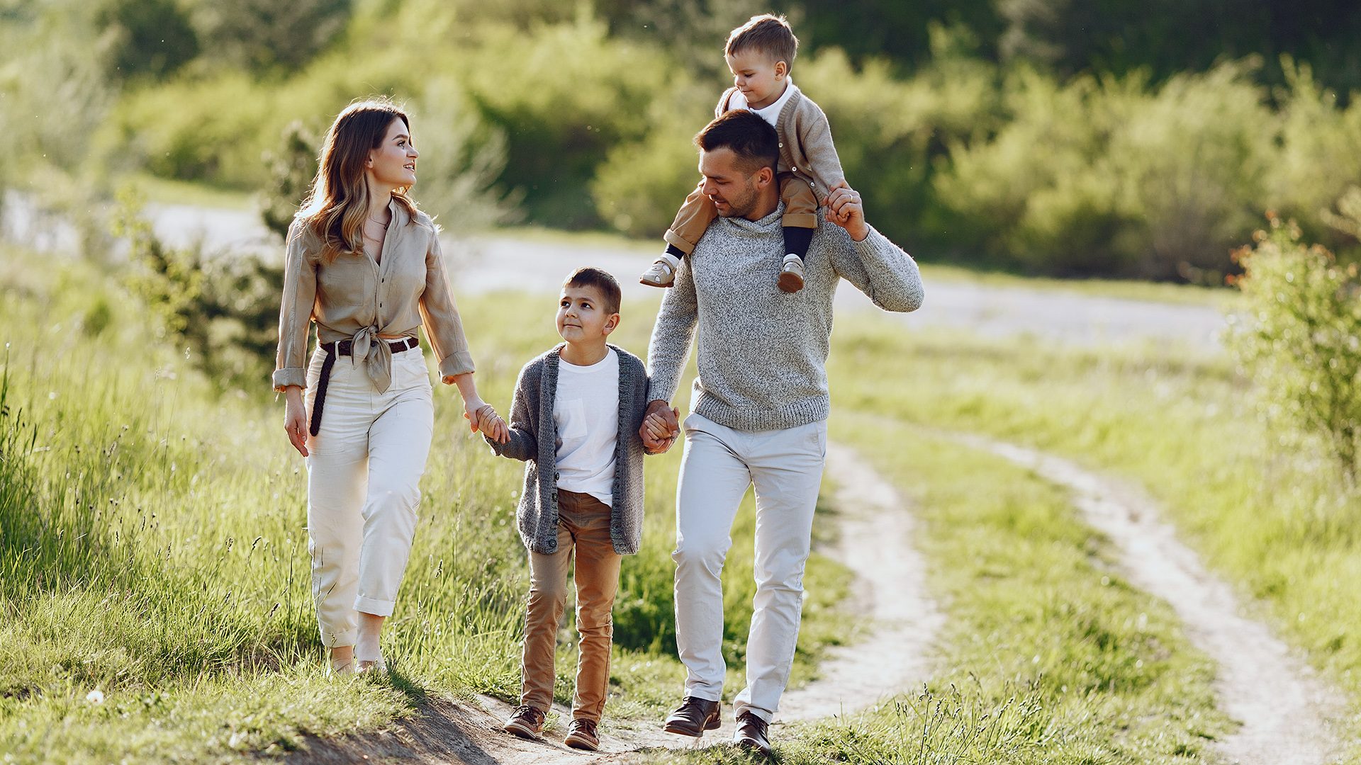 Cute family playing in a summer field