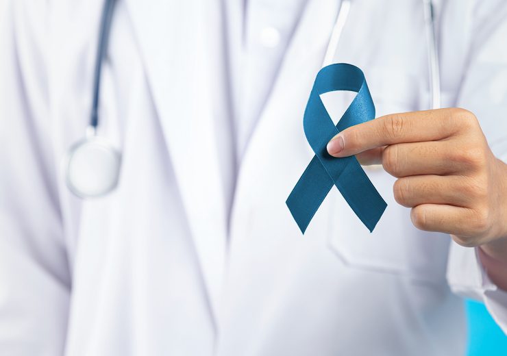 World Mental Health Day;doctor's hand holding green ribbon