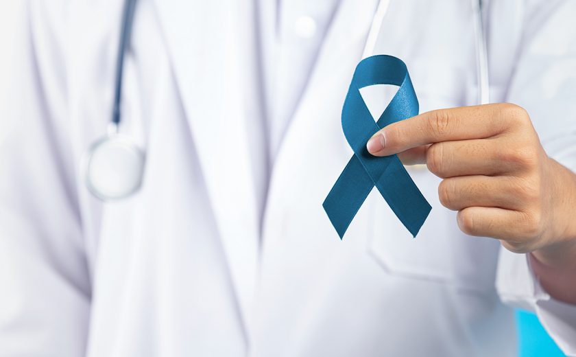 World Mental Health Day;doctor's hand holding green ribbon
