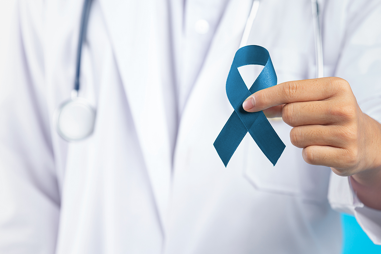 World Mental Health Day;doctor's hand holding green ribbon