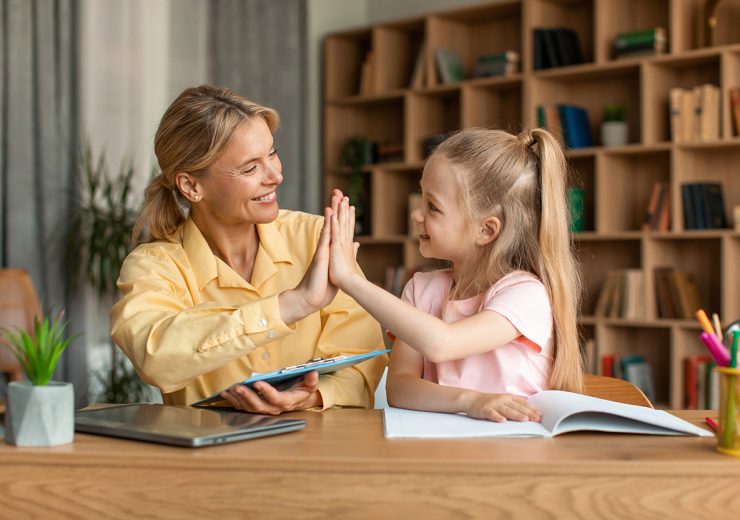 Well,Done.,Excited,Teacher,Giving,High,Five,To,Little,Girl,